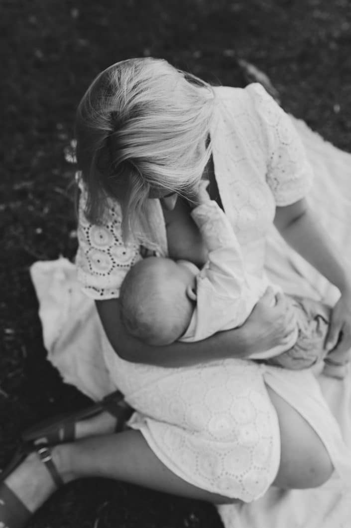 Black and white image of mum breastfeeding her little boy. basingstoke photographer. Ewa Jones Photography