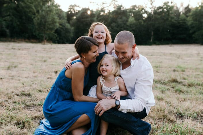 Family of four hugging each other | Natural family photoshoot in Hampshire | Ewa Jones Photography