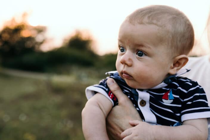 Little boy is looking away. Golden hour photo session in Basingstoke. Ewa Jones Photography