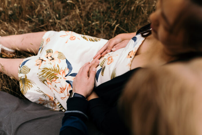 Both parents are holding bump. Maternity photography. Ewa Jones Photography