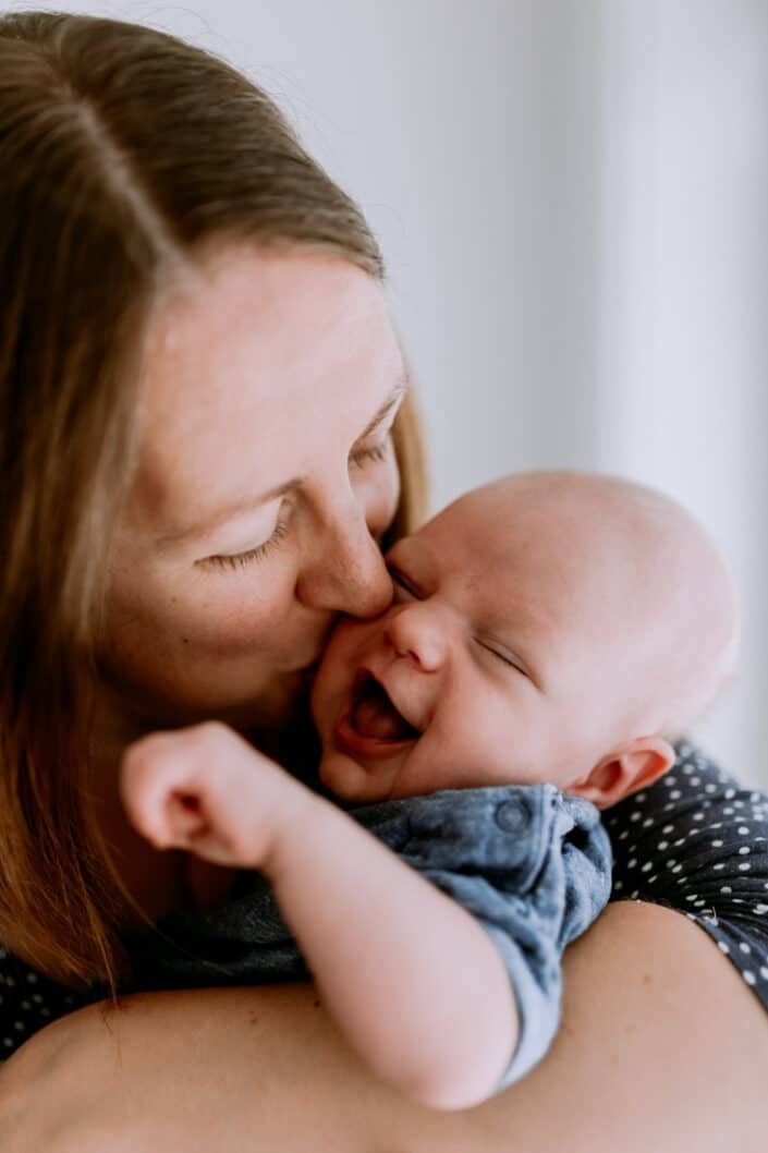 In home lifestyle newborn photo session. Mum and newborn. Natural family lifestyle photography in Hampshire. Ewa Jones Photography