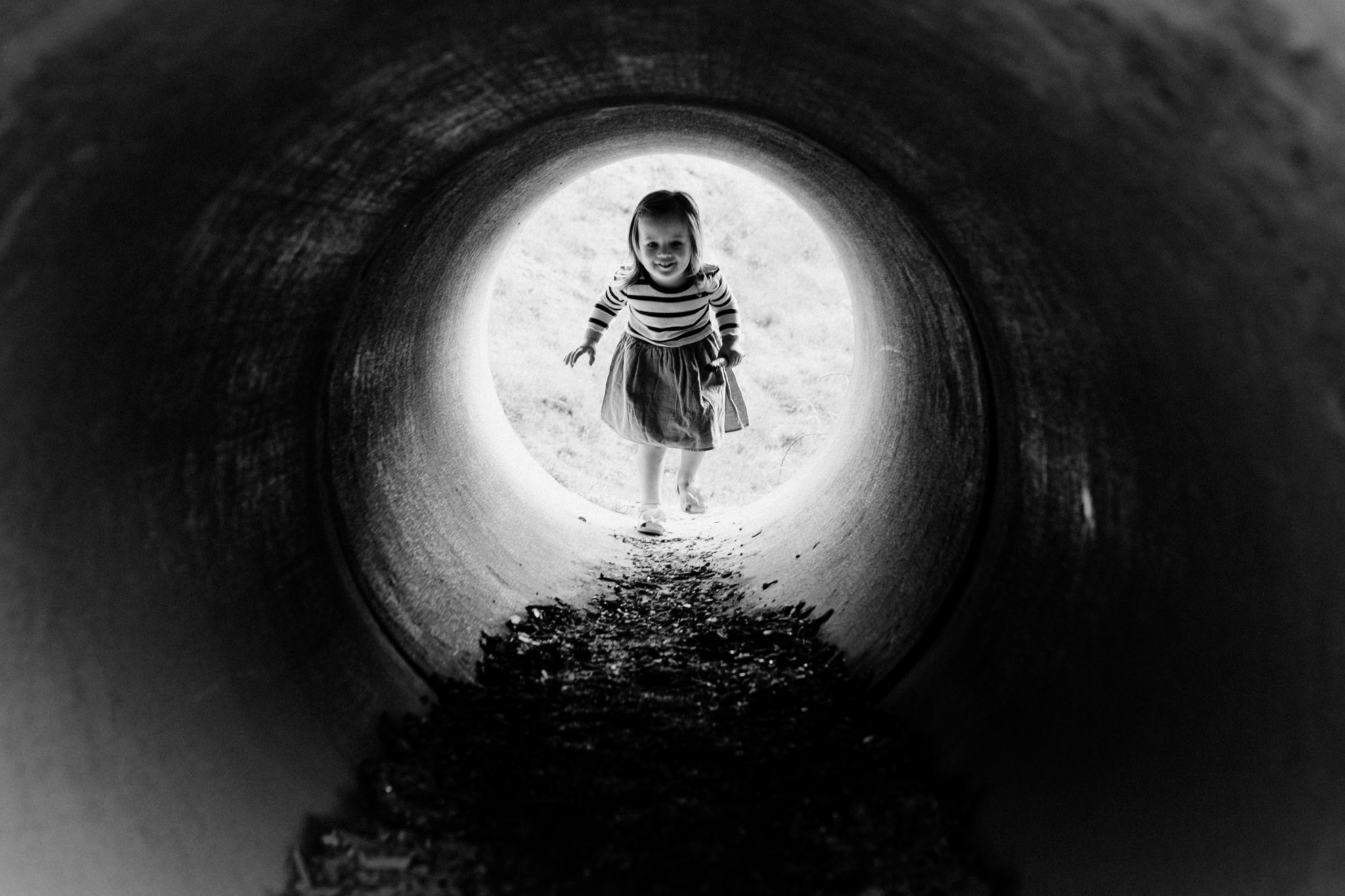 Girl walking through the tunnel | Let them explore | Wild Childhood | Hampshire | Basingstoke | Ewa Jones Photography