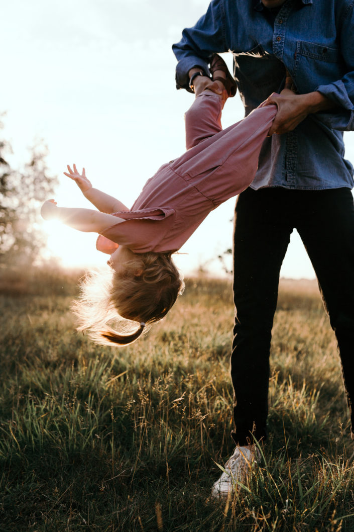 Toddler girl upside down. Family fun day out. Family sunset photoshoot in Basingstoke. Hampshire, Ewa Jones Photography