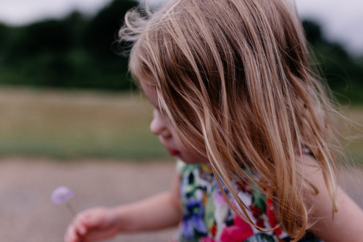 Little girl in wild flowers, hair details by Ewa Jones Photography
