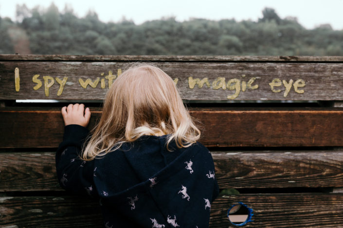 Girl looking through the hole by Ewa Jones Photography | Basingstoke and Hampshire Photography