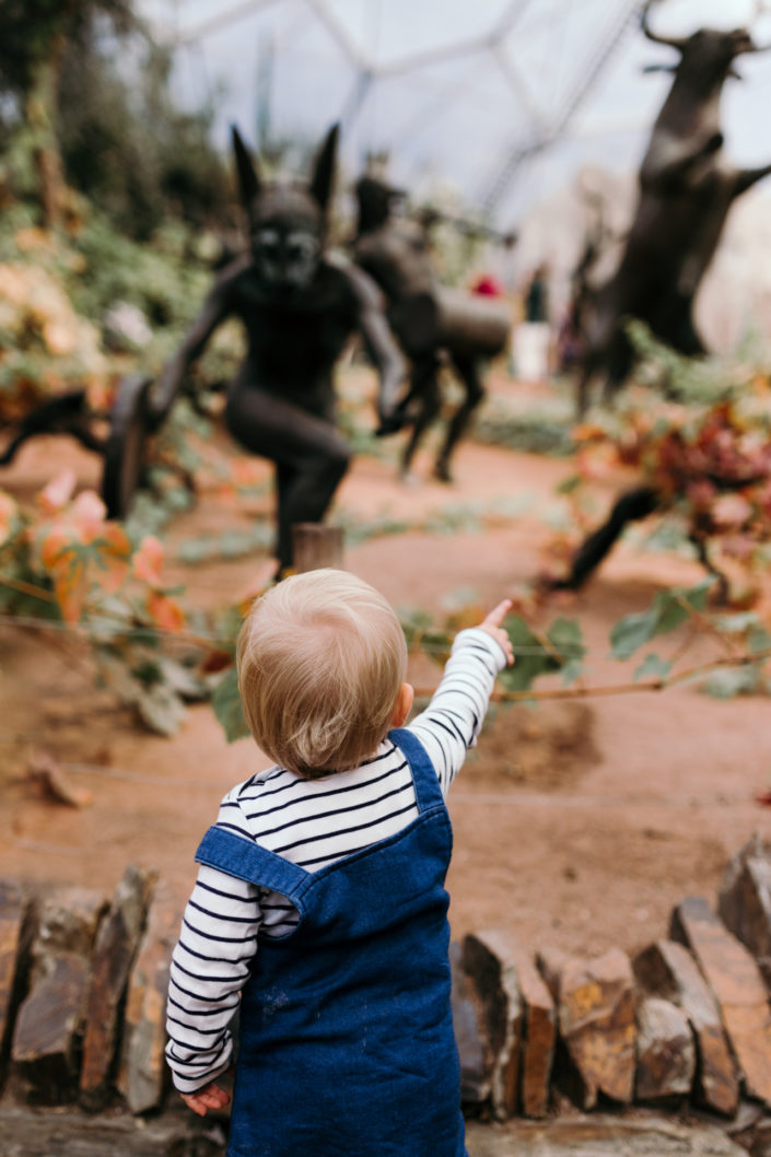 Girl pointing at sculptures at the Eden Project by Ewa Jones Photography