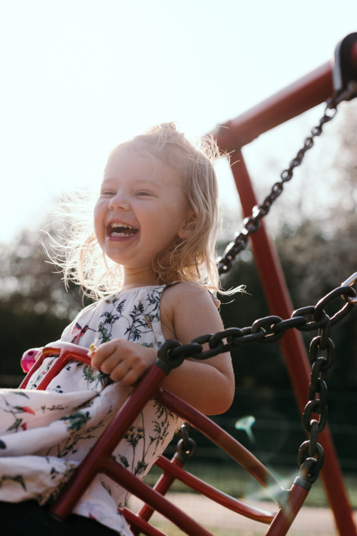 Happy girl on the swing by Ewa Jones Photography