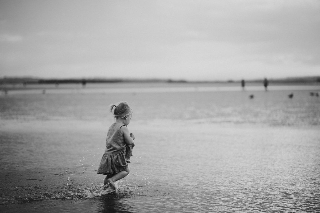 Girl is running on the beach. Sunset photography