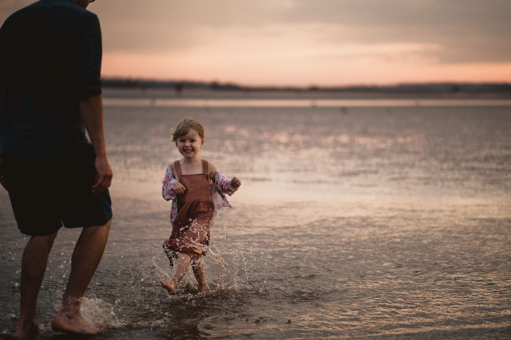 Girl is running on the beach. Sunset photography