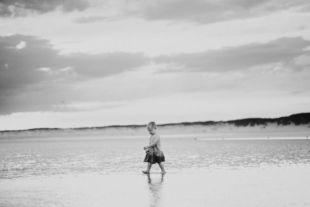 Girl is running on the beach. Sunset photography