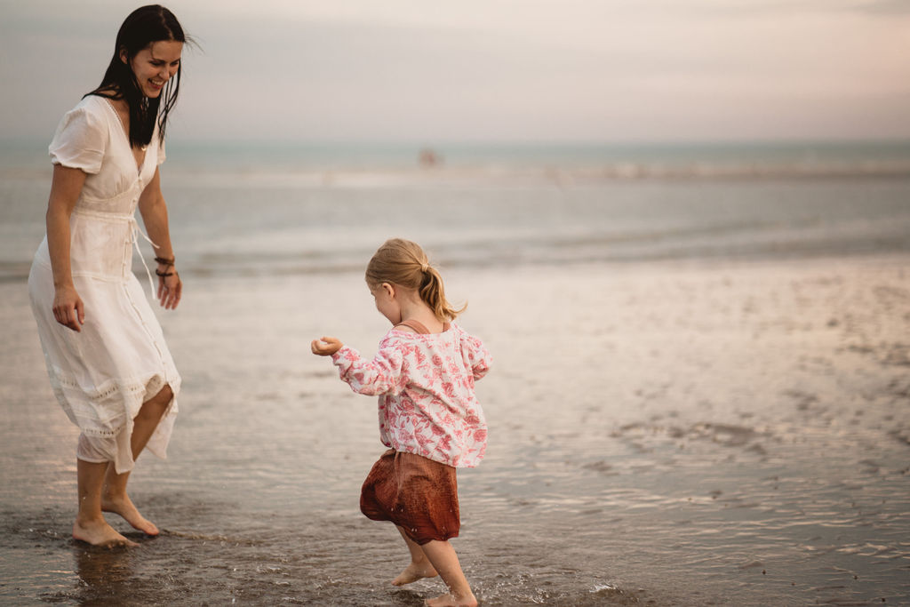 Girl is running on the beach. Sunset photography