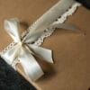 Close up of packaging for the family photography vouchers. Lovely brown box with cream ribbon on top. Newborn, maternity and family photography vouchers. Ewa Jones Photography