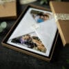 Close up detail of a photography gift voucher. Beautifully wrapped in tissue paper and brown box. Ewa Jones Photography