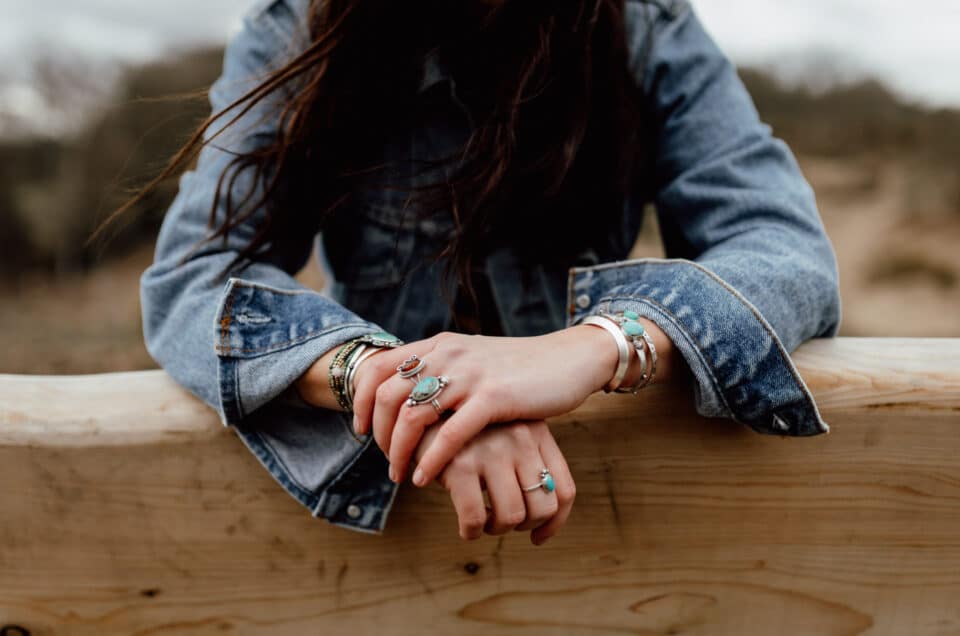 Product photography with Rusticrafts. Close up of girls hands resting on the bench. She is wearing lovely hand made jewellery. Products photography in Hampshire. Ewa Jones Photography