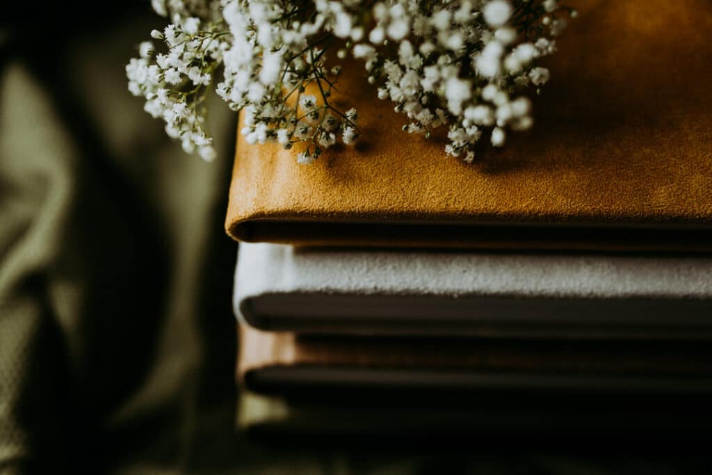 close up detail shot of 3 photo albums with various colours. Family photo albums. Ewa Jones Photography. Basingstoke photographer