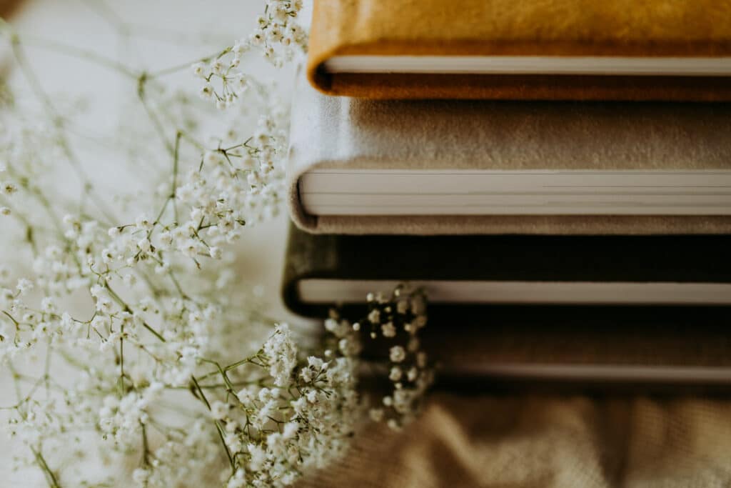 close up detail shot of 3 photo albums with various colours. Family photo albums. Ewa Jones Photography. Basingstoke photographer