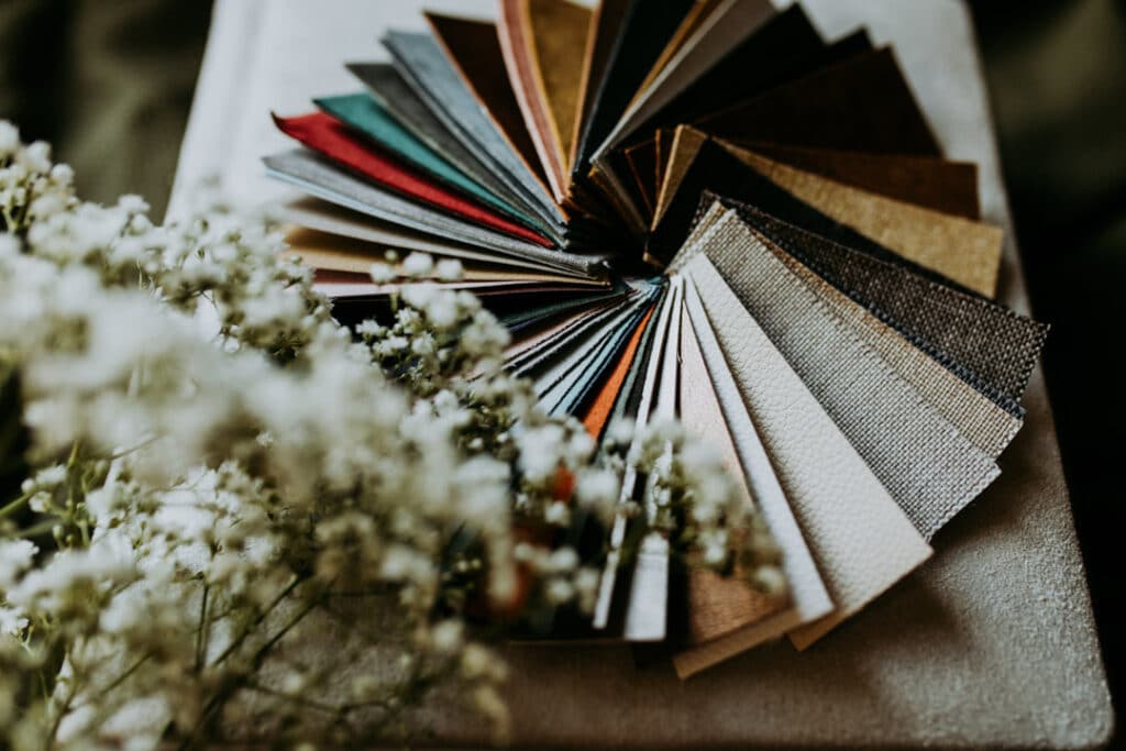 Photograph of album swatch samples in various colours on the ring. they lay on white photo album. Family photo albums. Family photographer in Basingstoke. Ewa Jones Photography