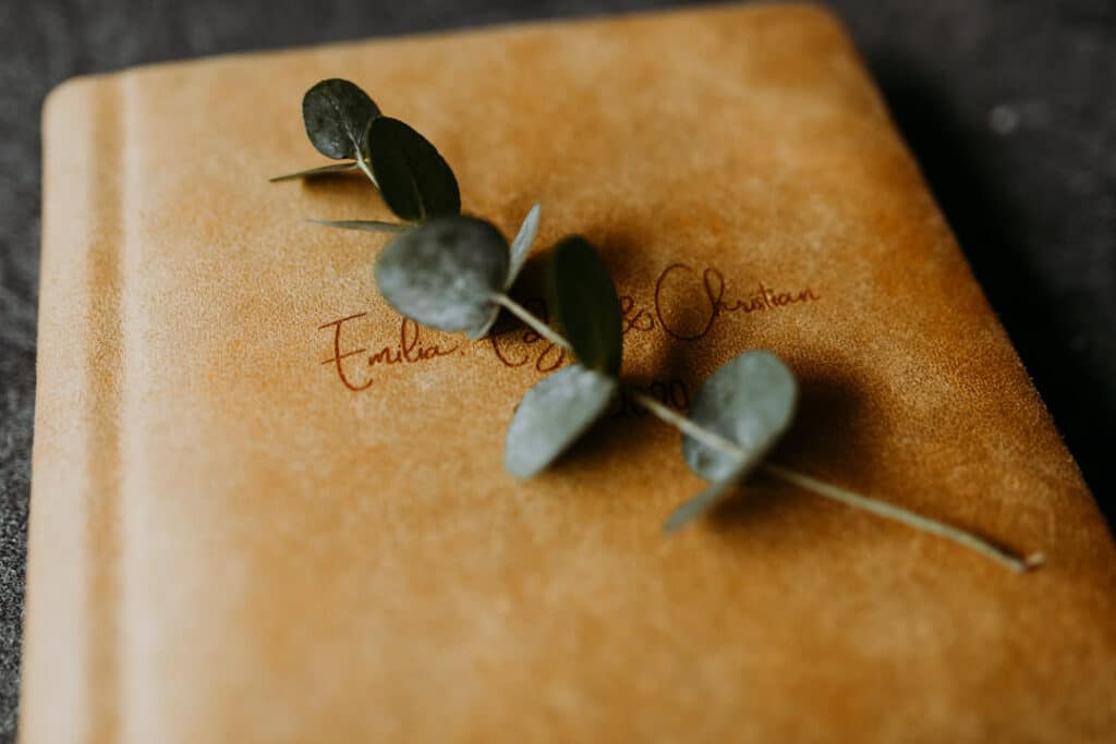 Close up of a family photo album. Lovely orange colour of an album. Family photo albums in Basingstoke. Ewa Jones Photography