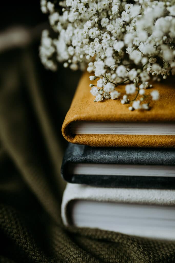 close up detail shot of 3 photo albums with various colours. Family photo albums. Ewa Jones Photography. Basingstoke photographer