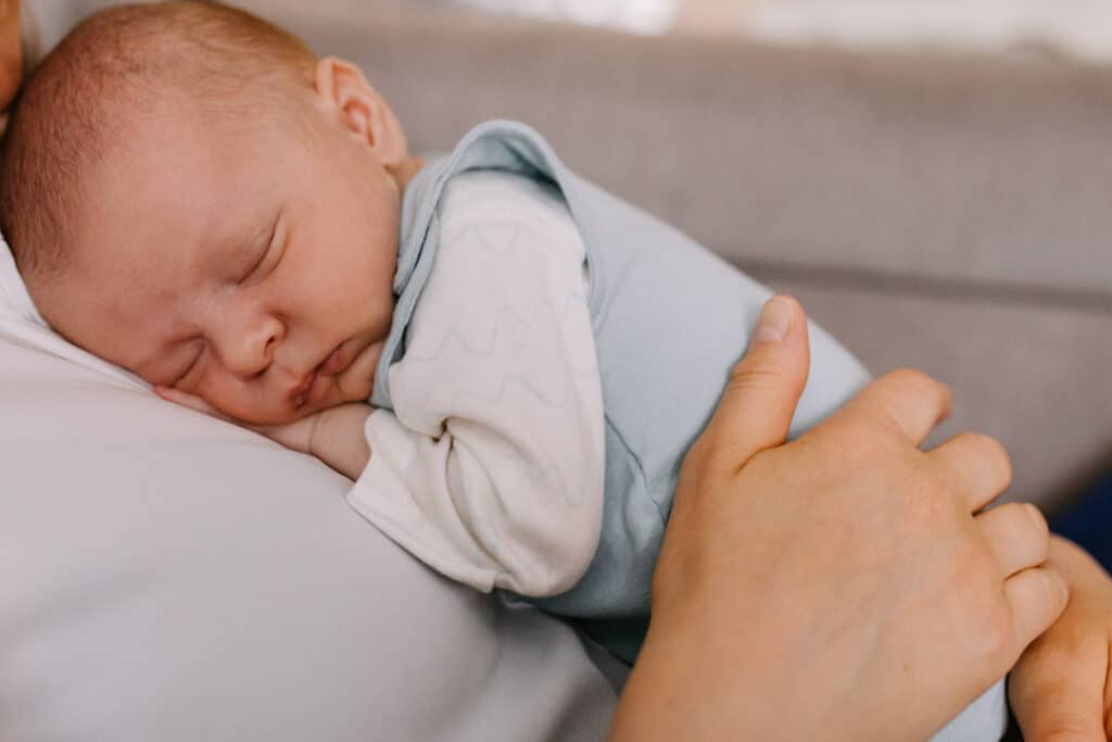 Close up detail photograph of newborn baby. Newborn baby is sleeping on mummys chest. Newborn photoshoot in Basingstoke, Hampshire. Ewa Jones Photography