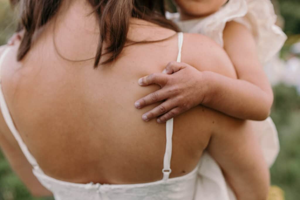 Close up detail of little girl holding her mum. family photographer in Basingstoke, Hampshire. Ewa Jones Photography