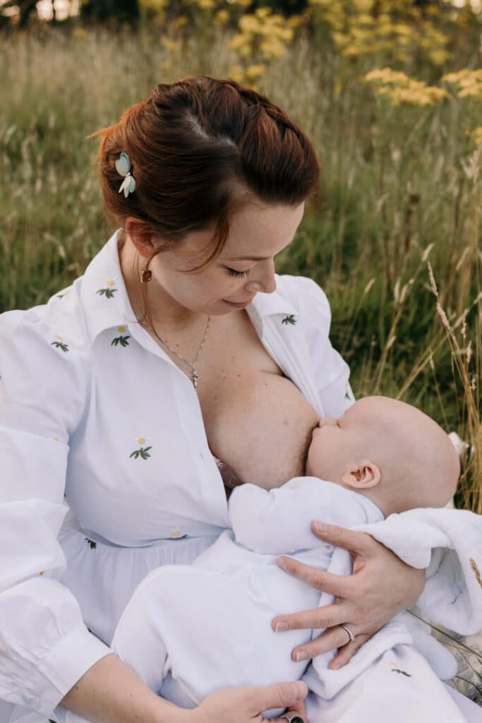 Mum is breastfeeding her little baby boy. Lovely candid photograph of mum and her baby. World breastfeeding week. Breastfeeding photo session in Basingstoke, Hampshire. Family photographer in Basingstoke, Ewa Jones Photography
