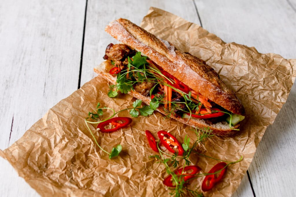 Lovely Vietnamese street food bun with chicken and vegetables inside. Food photographer in Hampshire. Ewa Jones Photography