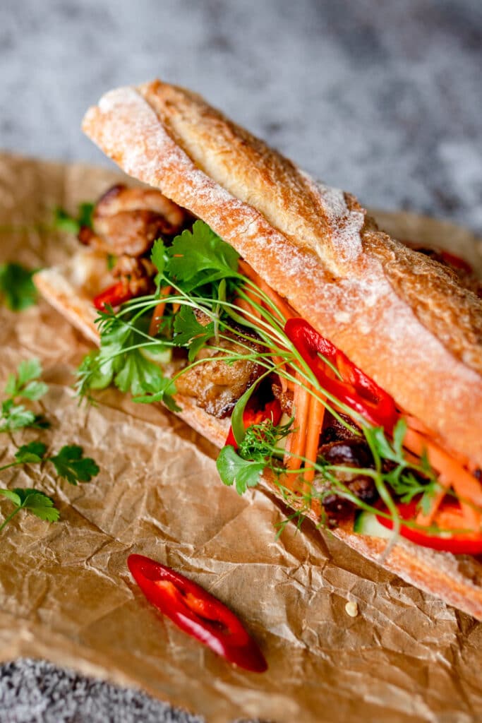 Lovely Vietnamese street food bun with chicken and vegetables inside. Food photographer in Hampshire. Ewa Jones Photography