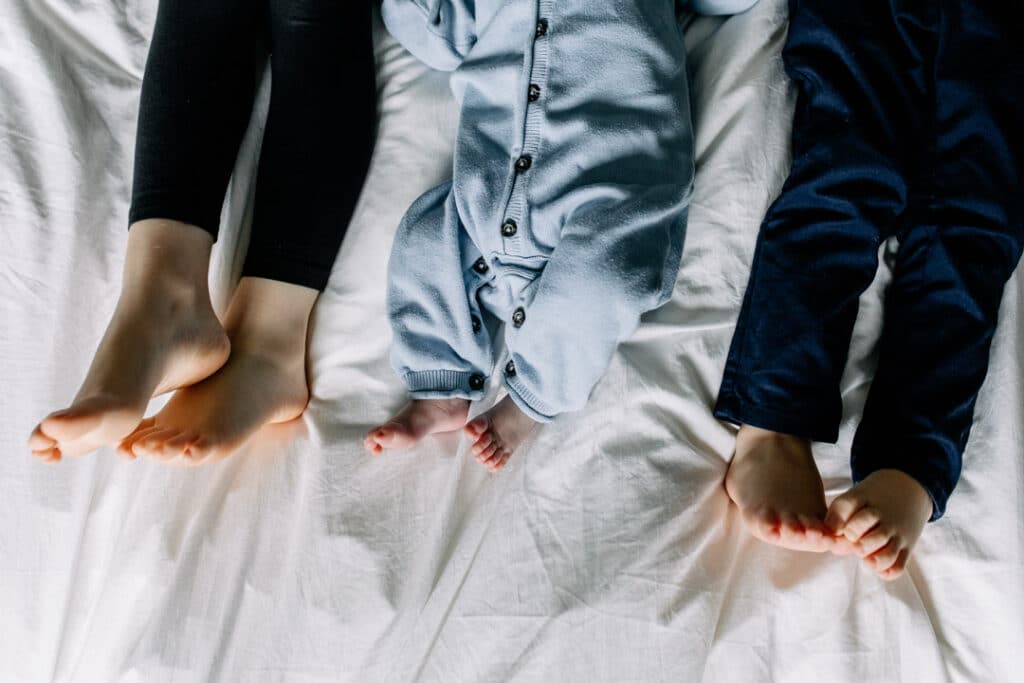 Close up image of feet of siblings. Newborn photo shoot in Basingstoke, Hampshire. Ewa Jones Photography