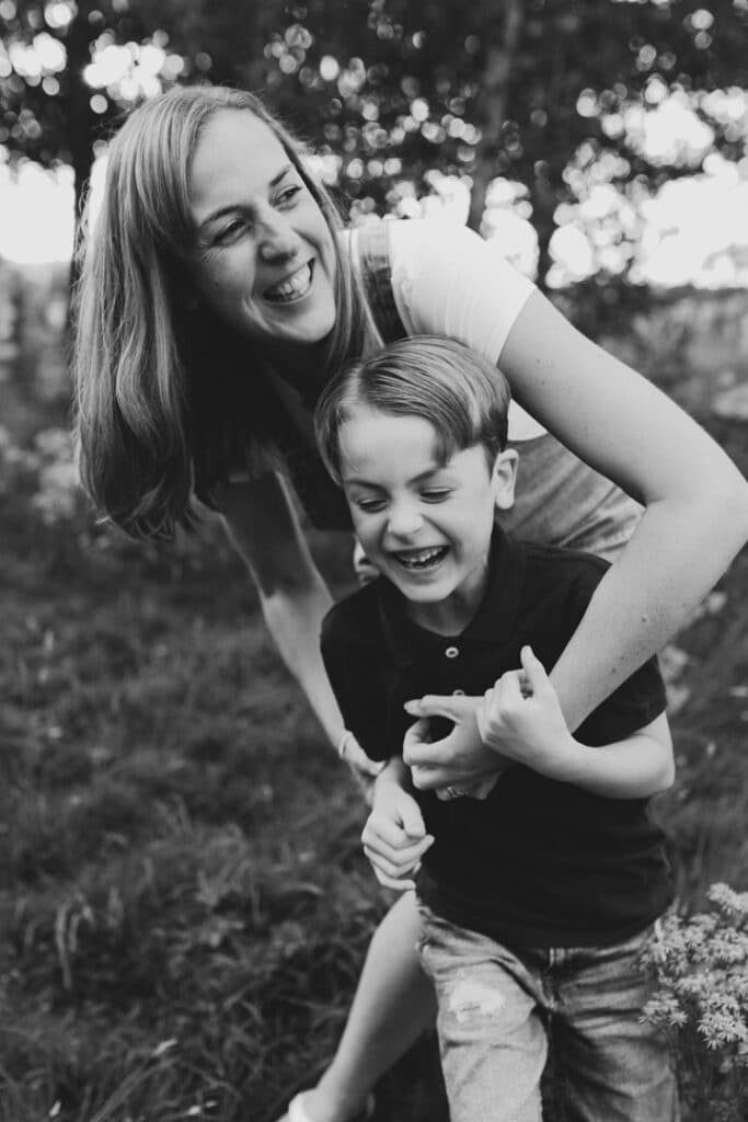 Mum and her son are ticking and laughing. Natural and unposed family photo session in Basingstoke. Hampshire family photographer. Ewa Jones Photography