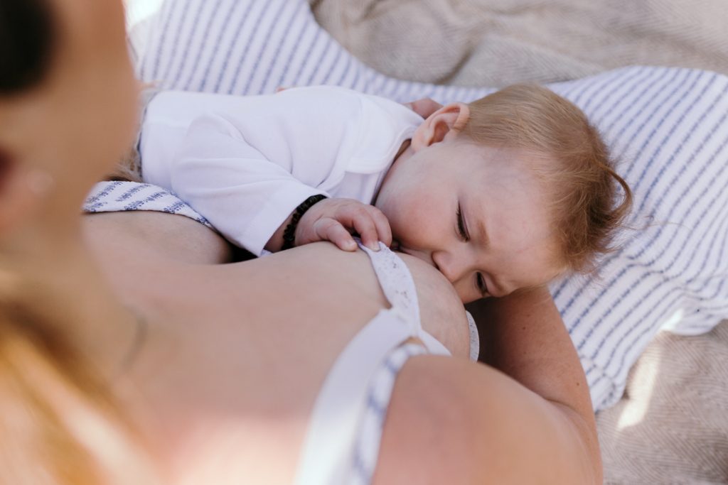 Mum is breastfeeding her baby boy. mummy and me photoshoot in Basingstoke, Hampshire. newborn photographer in Basingstoke. Ewa Jones Photography