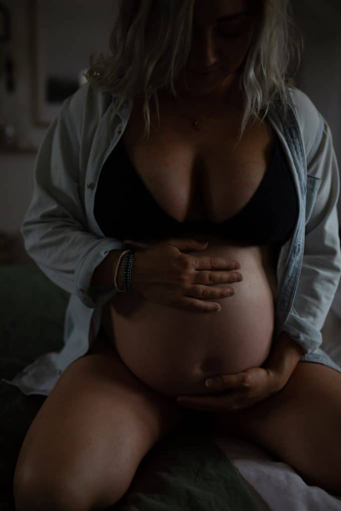 Close up detail of mummy's baby bump. Maternity photo shoot in Basingstoke, Hampshire. Ewa Jones Photography