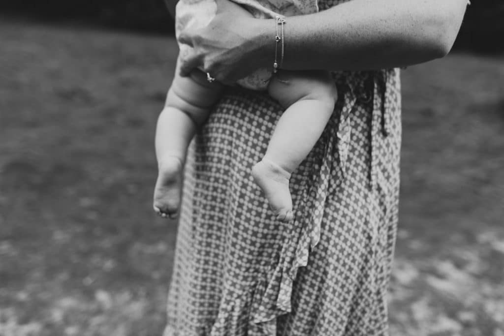 Close up detail of mum holding baby girl in her arms. Basingstoke family photographer. Ewa Jones Photography