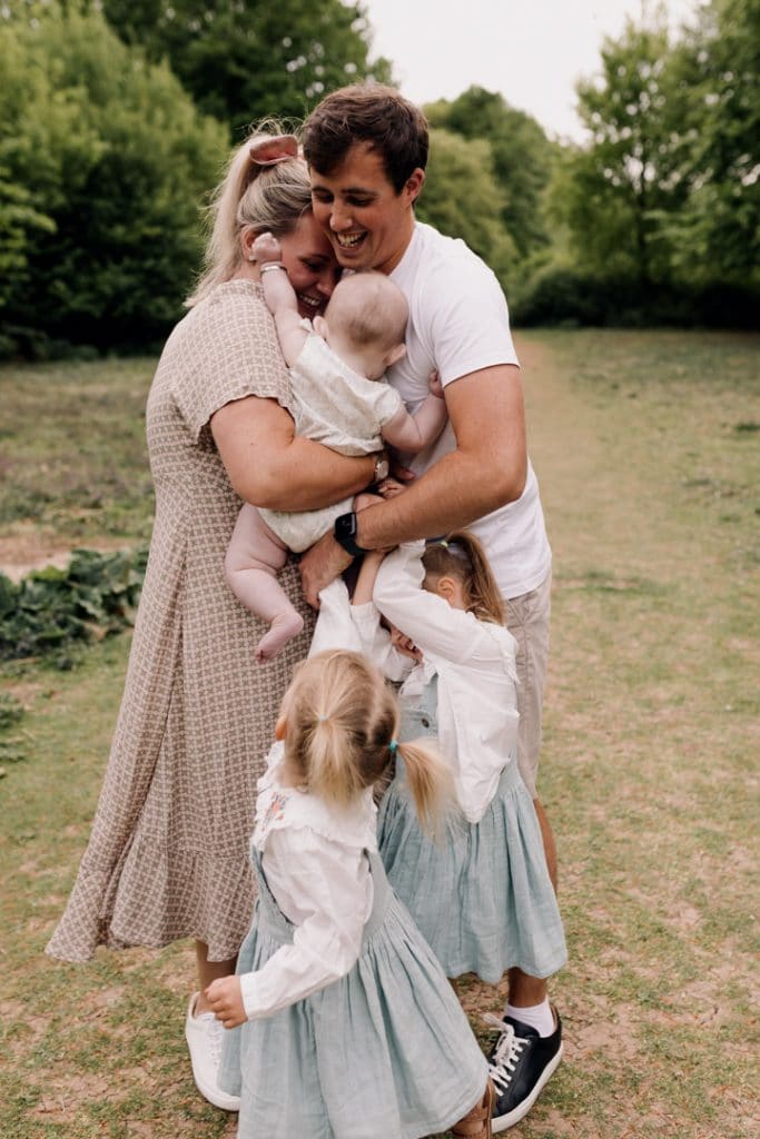 Family is cuddling. family photographer in Hampshire. Ewa Jones Photography