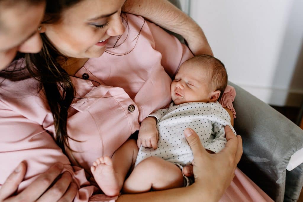 Newborn baby boy is sleeping and smiling. Newborn photographer in London. Ewa Jones Photography