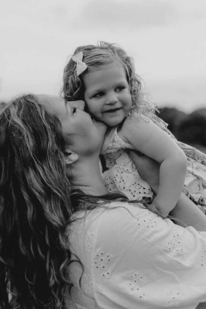 mum is cuddling her baby girl. family photo shoot in Basingstoke. Hampshire photographer. Ewa Jones Photography