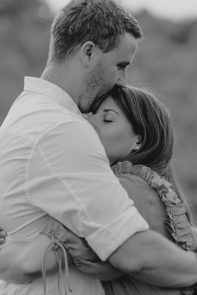 black and white image of couple cuddling. engagement photo session in Hampshire. Hampshire photographer. Ewa Jones Photography