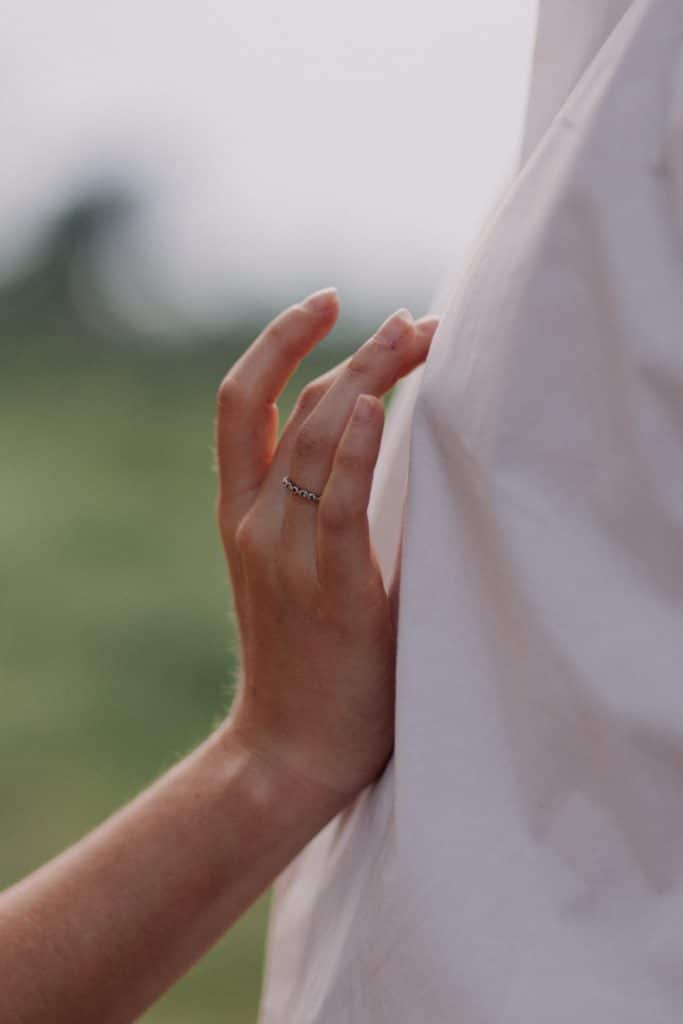 close up image of female hand touching a male chest. Couple photo session in Hampshire. Hampshire photographer. Ewa Jones Photography