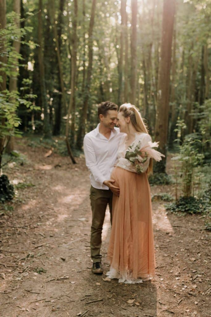 Maternity photo session - Grace and Chris-3 expecting couple is cuddling up and smiling to each other. Hampshire photographer. maternity photography. Ewa Jones Photography