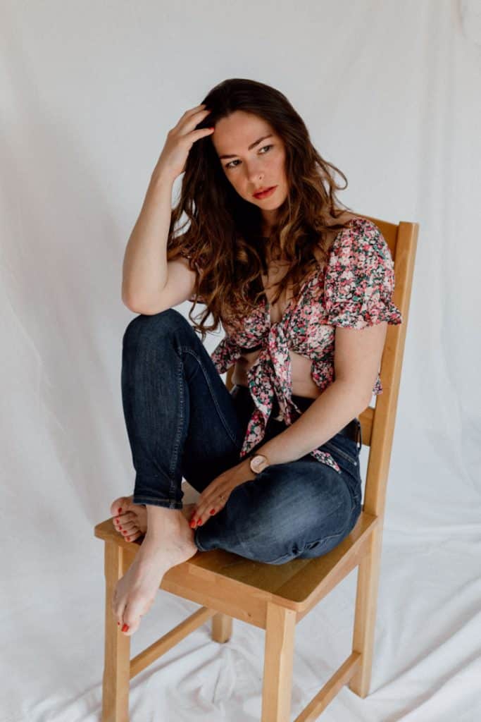 Woman is sitting on the chair and looking away. portrait female photo session. model photo session. Model photographer. Women photography in Hampshire. Ewa Jones Photography