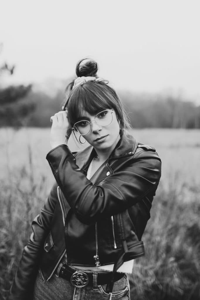 Female is wearing a black leather jacket and looking at the camera. Women photo session in Hampshire. Hampshire photographer. Ewa Jones Photography