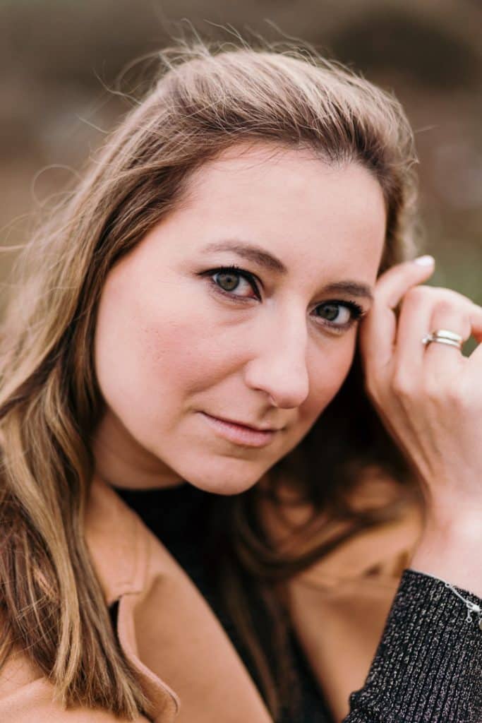 lovely portrait of female looking at the camera. She has beautiful eyes and touching side of her head. Female poses. Female photo shoot in Hampshire. Basingstoke photographer. Ewa Jones Photography empowering female photo sessions