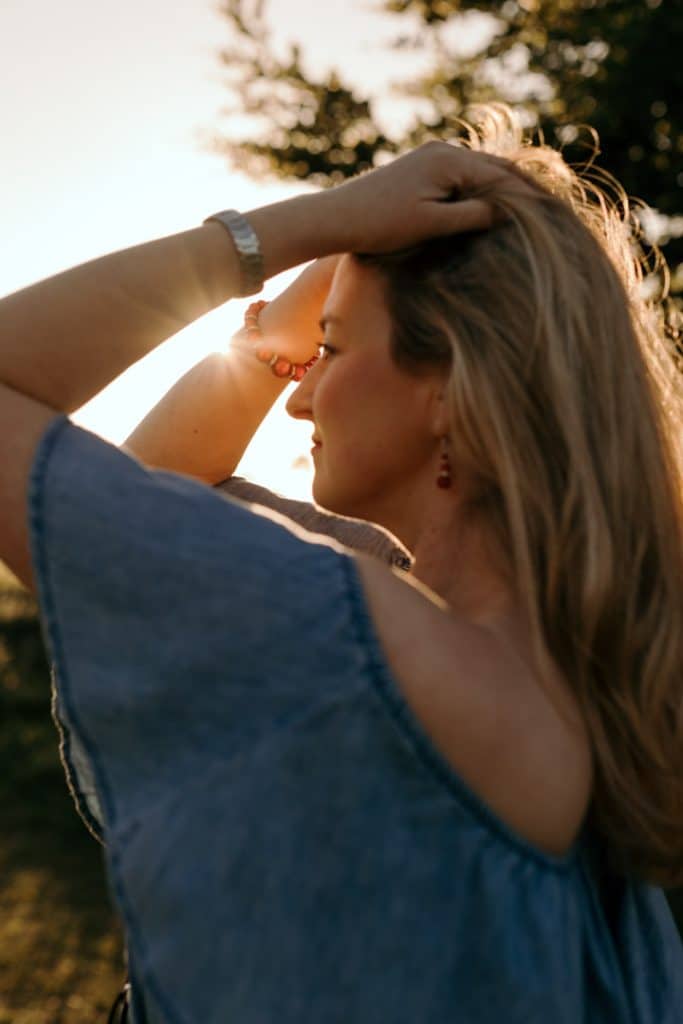 Female is standing and looking away. lovely sunset female photo session. Empowering female photo sessions. Female photo session in Basingstoke hamsphire. Hampshire photographer. Basingstoke female photographer.Ewa Jones Photography