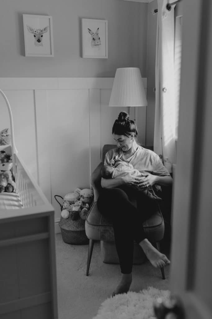 Mum is breastfeeding her newborn baby. Newborn photoshoot in Basingstoke. Ewa Jones Photography