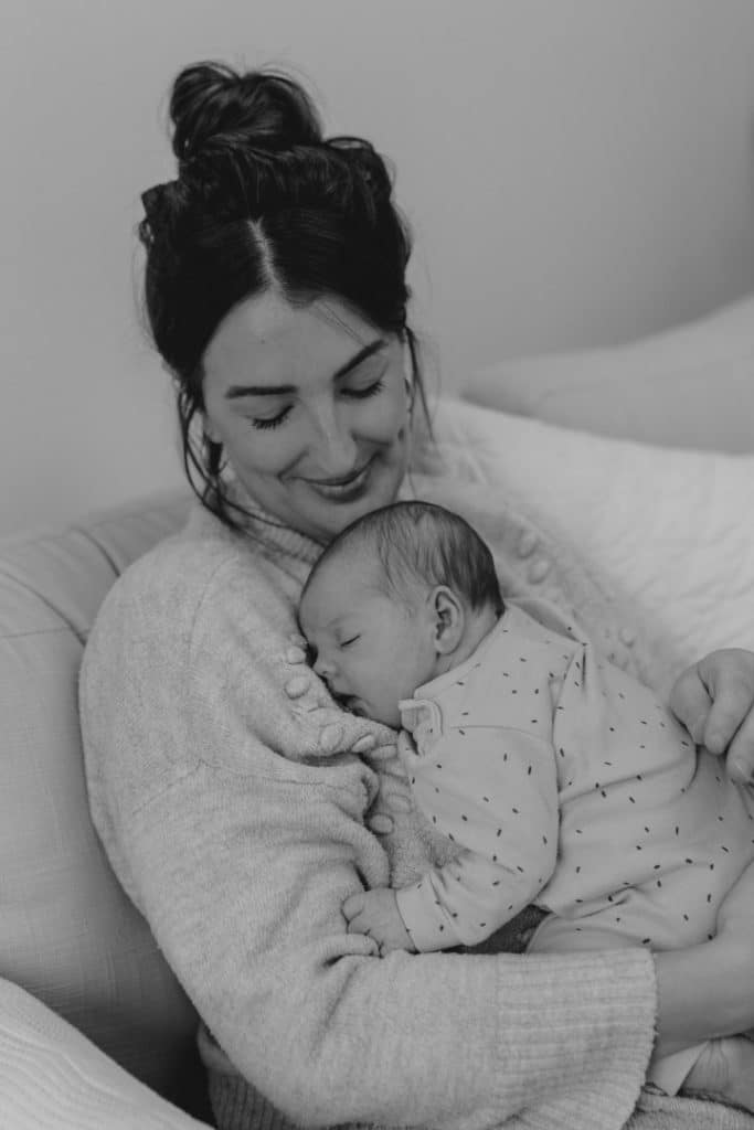 Mum is cuddling to her baby girl. Newborn photoshoot in Basingstoke. Ewa Jones Photography