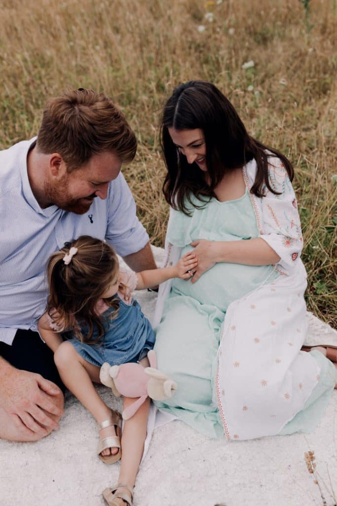 Little girl is touching mummys tummy. Lovely natural lifetyle maternity photo session in Hampshire. Hampshire photographer. Ewa Jones Photography