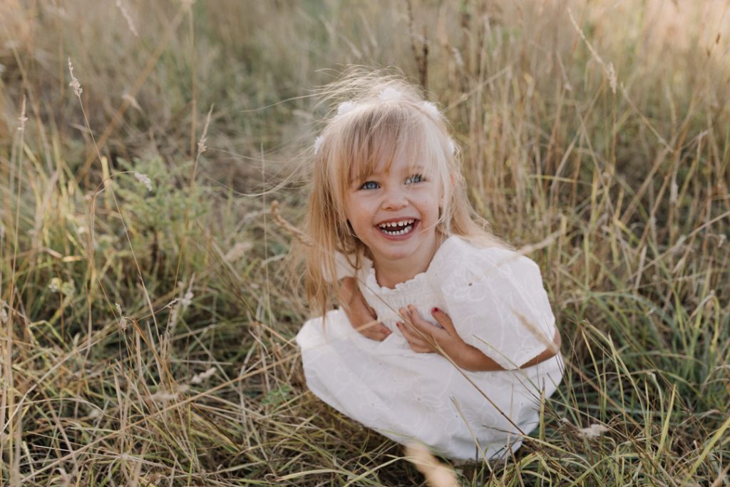 little girl is laughing. lovely family photo shoot in Hampshire. Basingstoke photographer. Hampshire family photographer. Ewa Jones Photography
