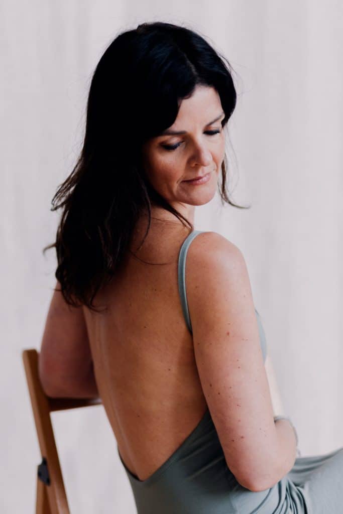 Female is looking down and wearing lovely green dress. Female photo session in Basingstoke Hampshire. Hampshire photographer. Ewa Jones Photography