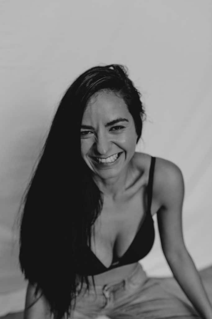 Black and white image of female smiling to the camera. Women empowerment photo shoot in Hampshire. Hampshire photographer. Ewa Jones Photography