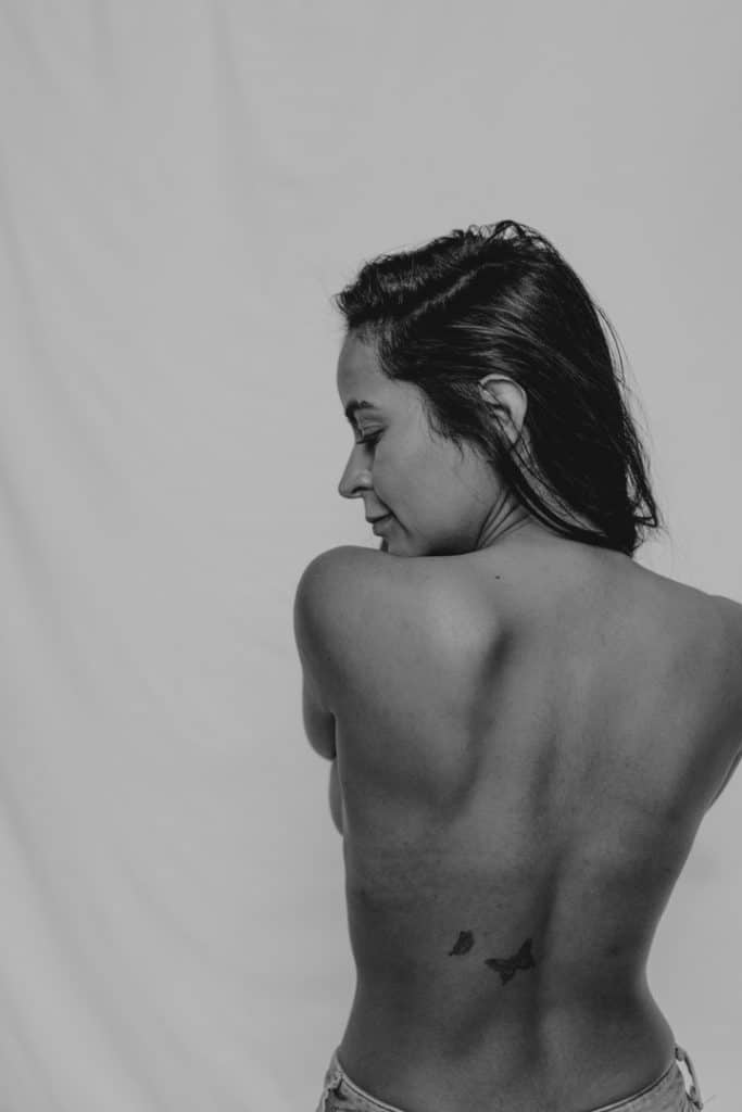 Female is looking down. Black and white female empowerment session. Photo shoot in Basingstoke. Basingstoke photographer. Ewa Jones Photography